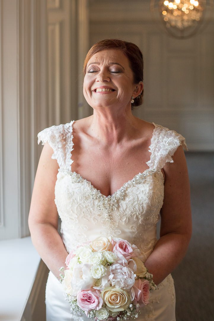 The bride enjoys a smile before the wedding at Barnett Hill Hotel