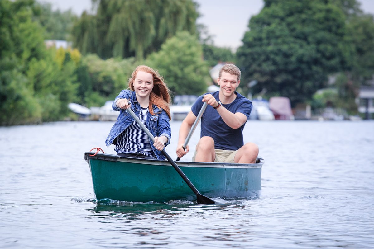 engagement photo session with young couple canoeing on the River Thames in Walton-on-Thames