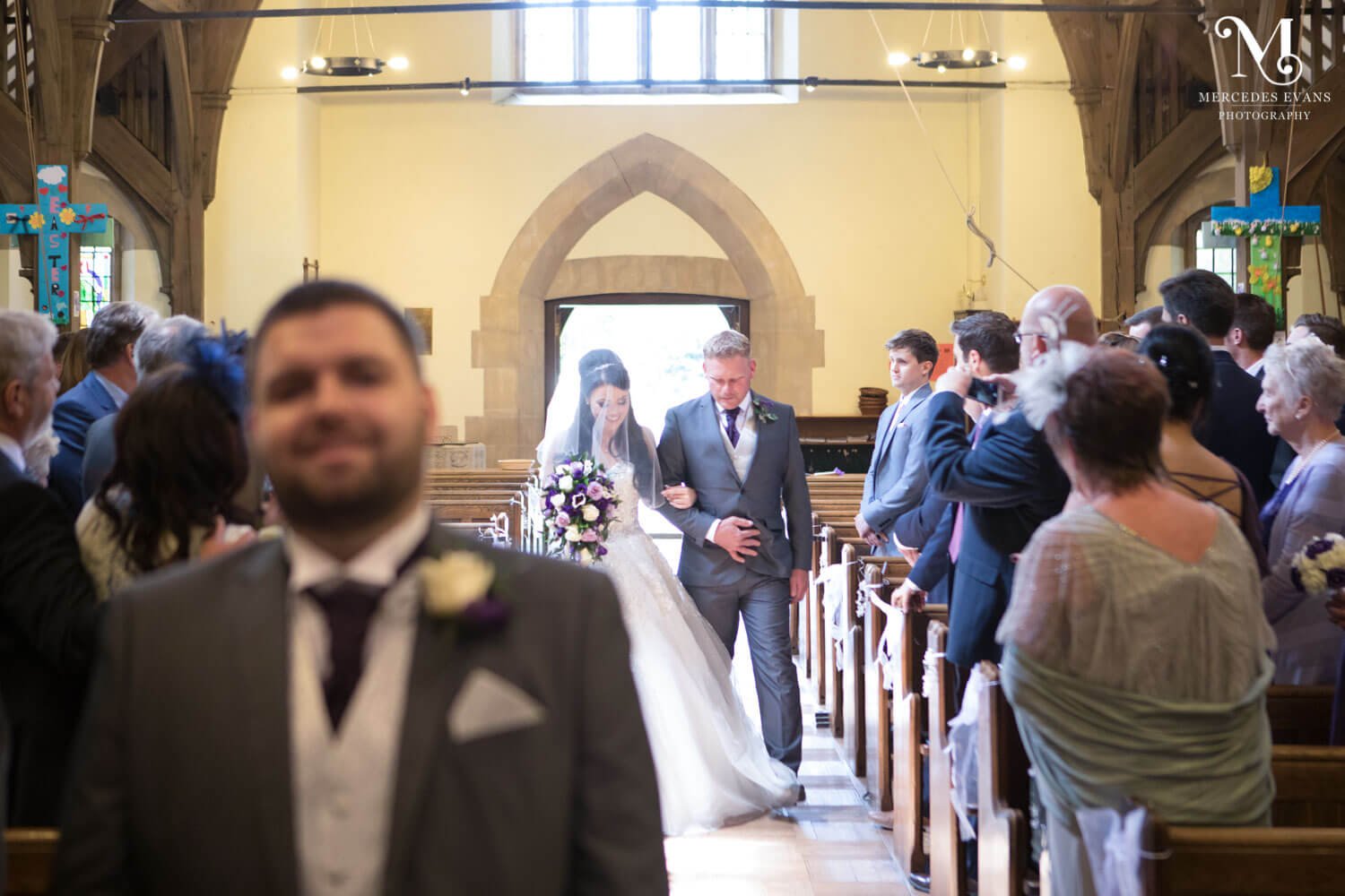 The bride walks down the aisle in St Andrew's church