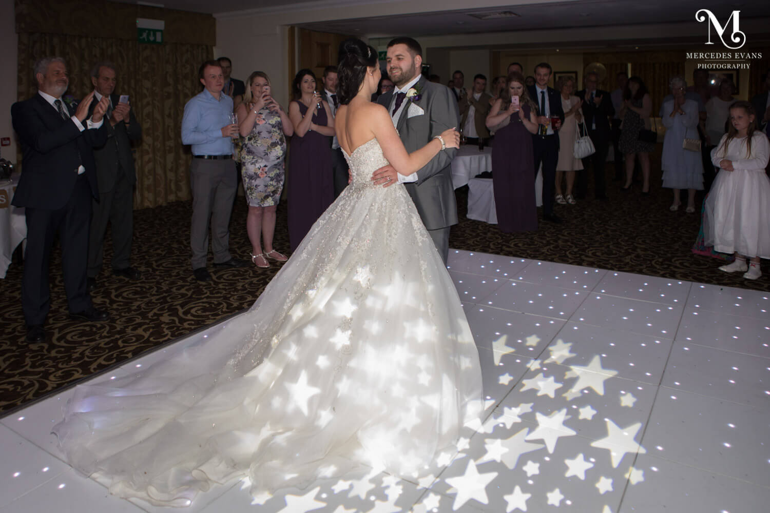The newly weds enjoy their first dance together in the Frimley Suite at Frimley Hall Hotel