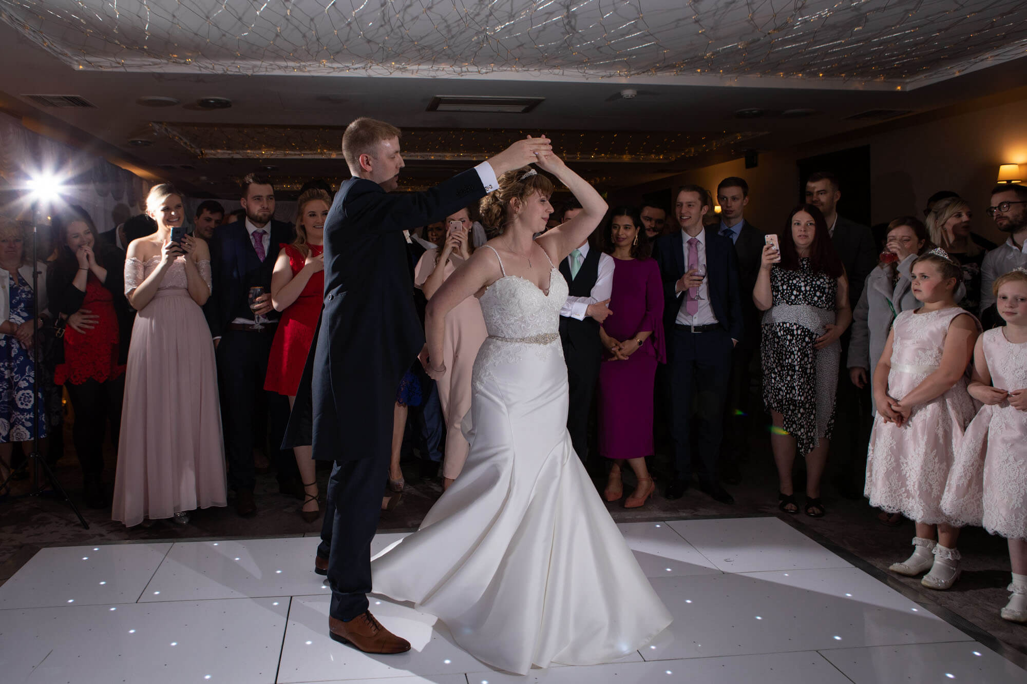 The couple perform a surprise choreographed first dance for the guests