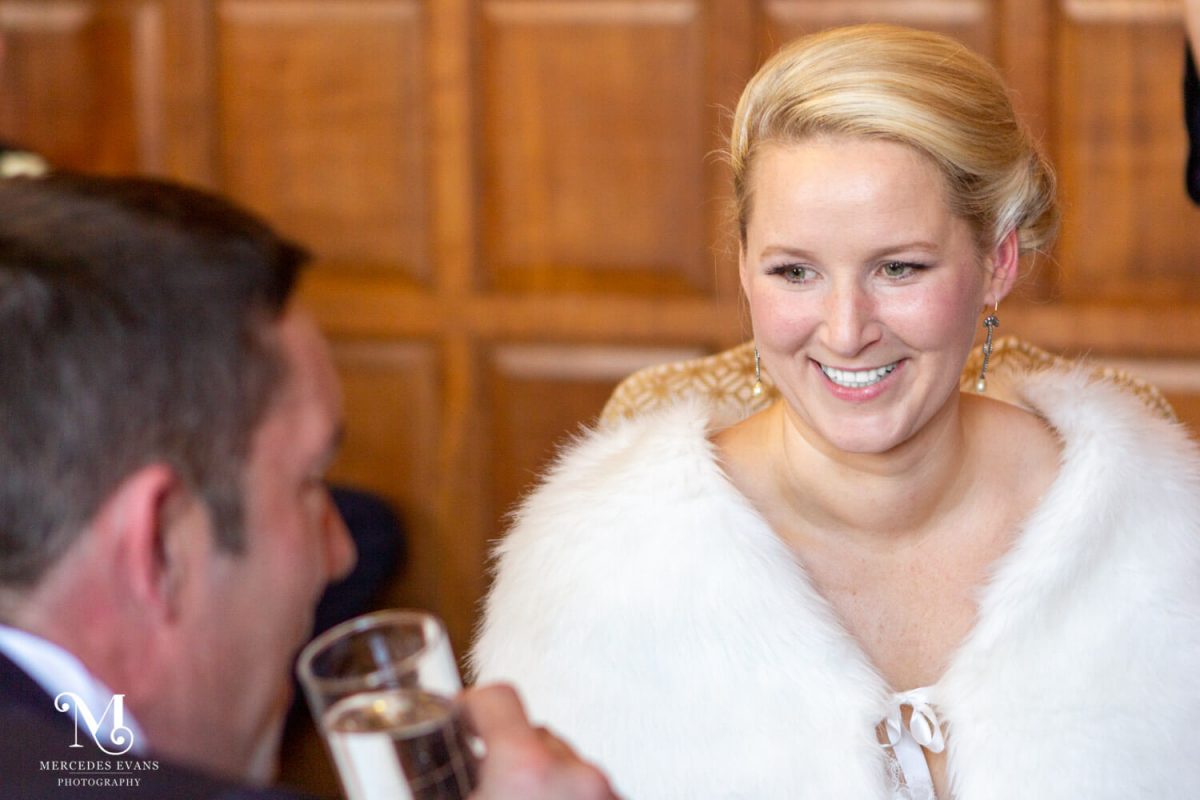 The bride smiles at her groom during the wedding service at the Elvetham