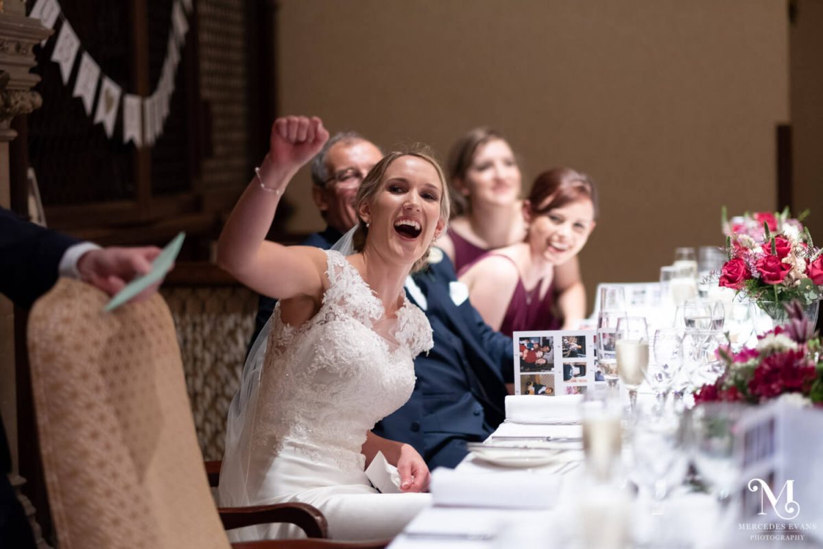 the bride pumps her fist and shouts during the best man's speech