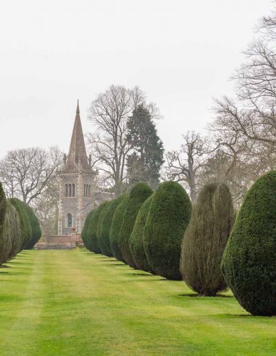 the avenue of yew trees with ST Mary's church in the distance at the Elvetham