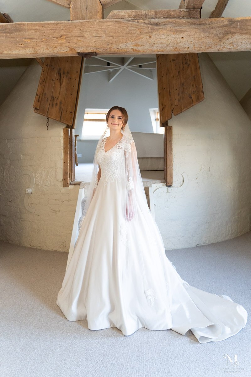 a bridal portrait in the Oast House flat at the Barn at Bury Court