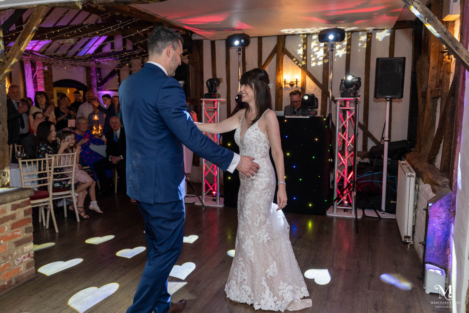 the bride and groom enjoy their first dance at their wedding