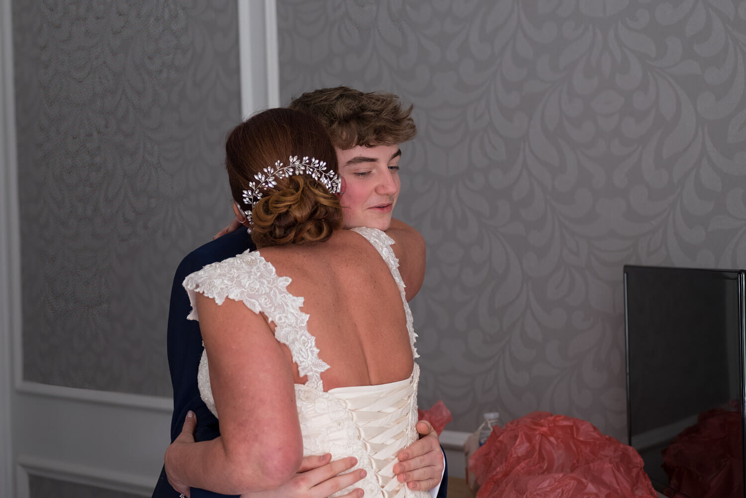 young man embraces the bride