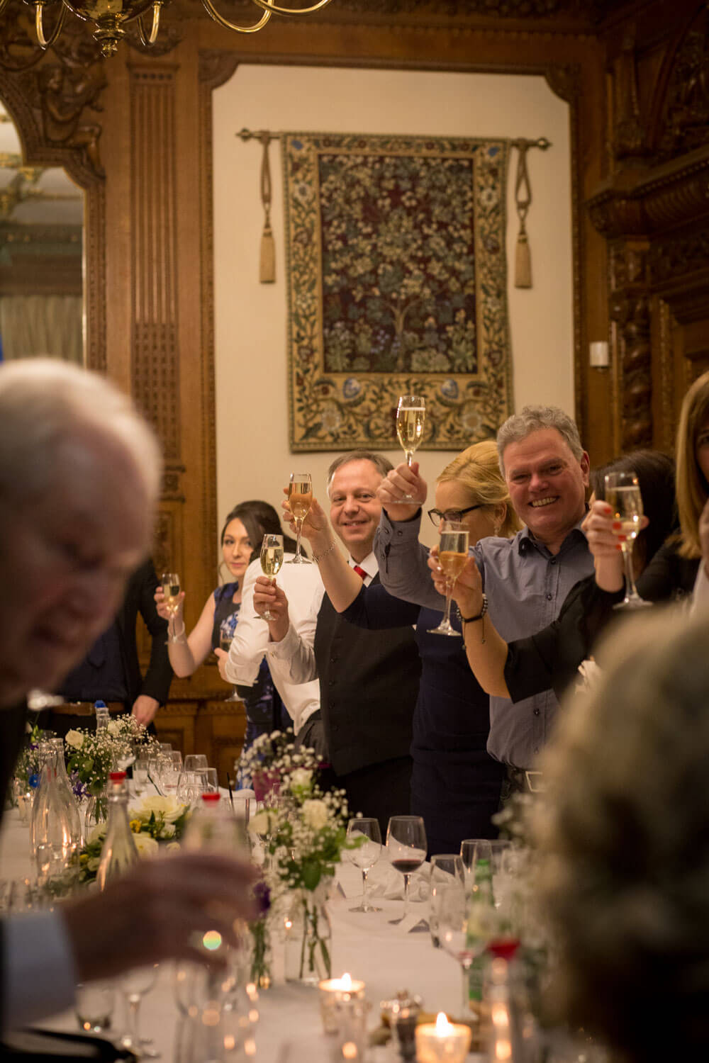 wedding guests toast the couple