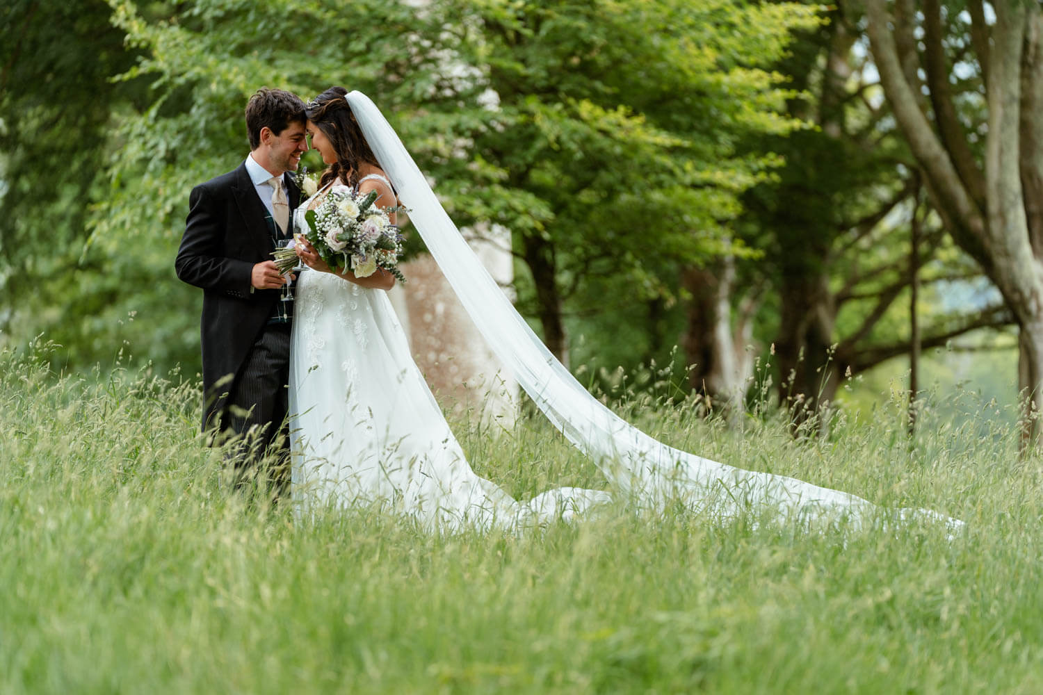 the bride and groom enjoy a quiet moment together during their couple photos