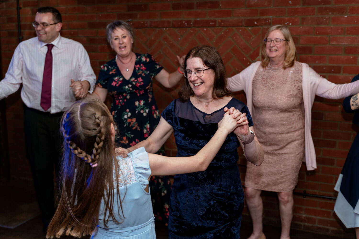 wedding guests laugh and dance as they enjoy the disco at Cantley House hotel