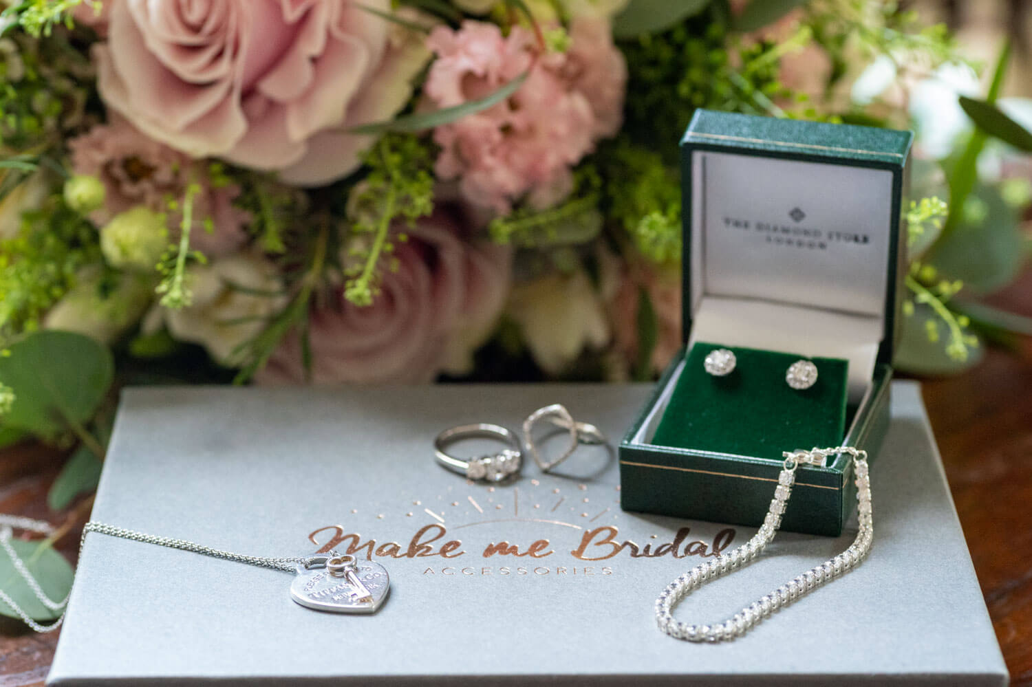 the bride's wedding jewellery and bouquet
